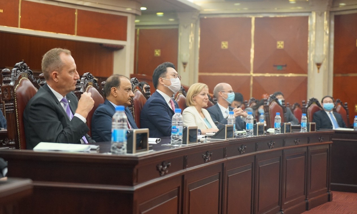 Representatives from multinational companies and universities on Thursday listened to the introduction of the basic legislative procedure in Shanghai. Photo: Global Times