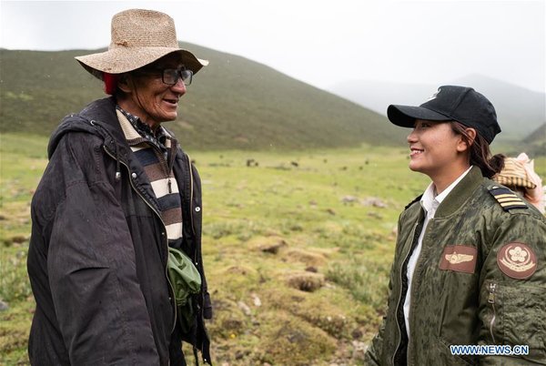 Female Pilot from Impoverished Family Flies Helicopter in China's Tibet